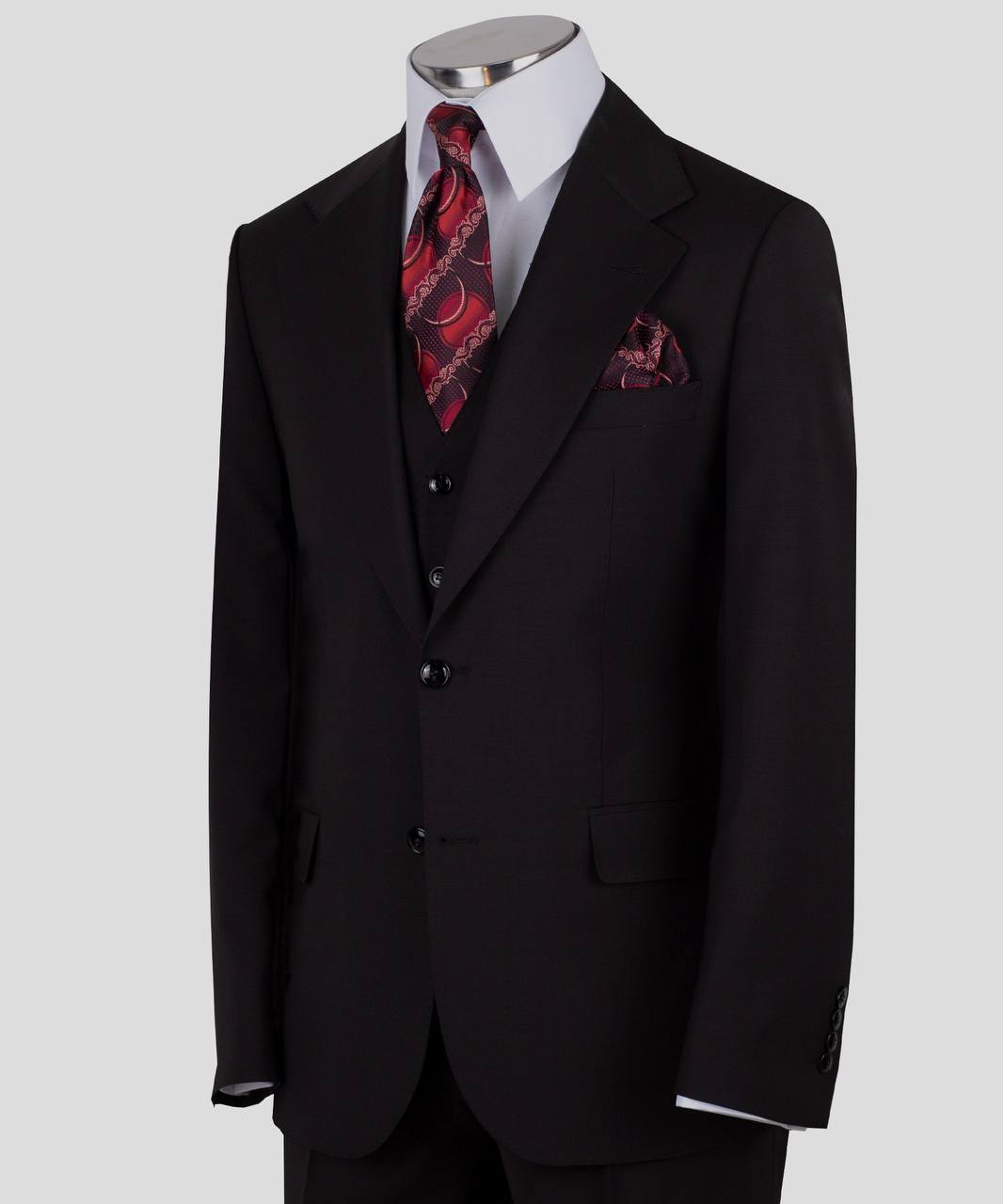 Black three-piece suit for men with jacket, vest, and trousers