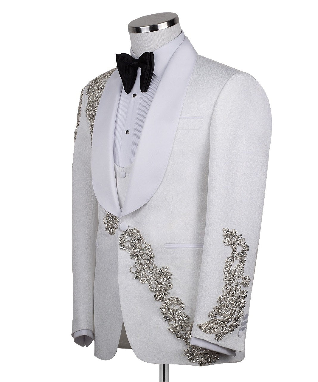 White hand-embellished jacquard three-piece tuxedo with crystal detailing on jacket and white satin shawl lapel. Master tailored in Istanbul for luxury events and weddings.