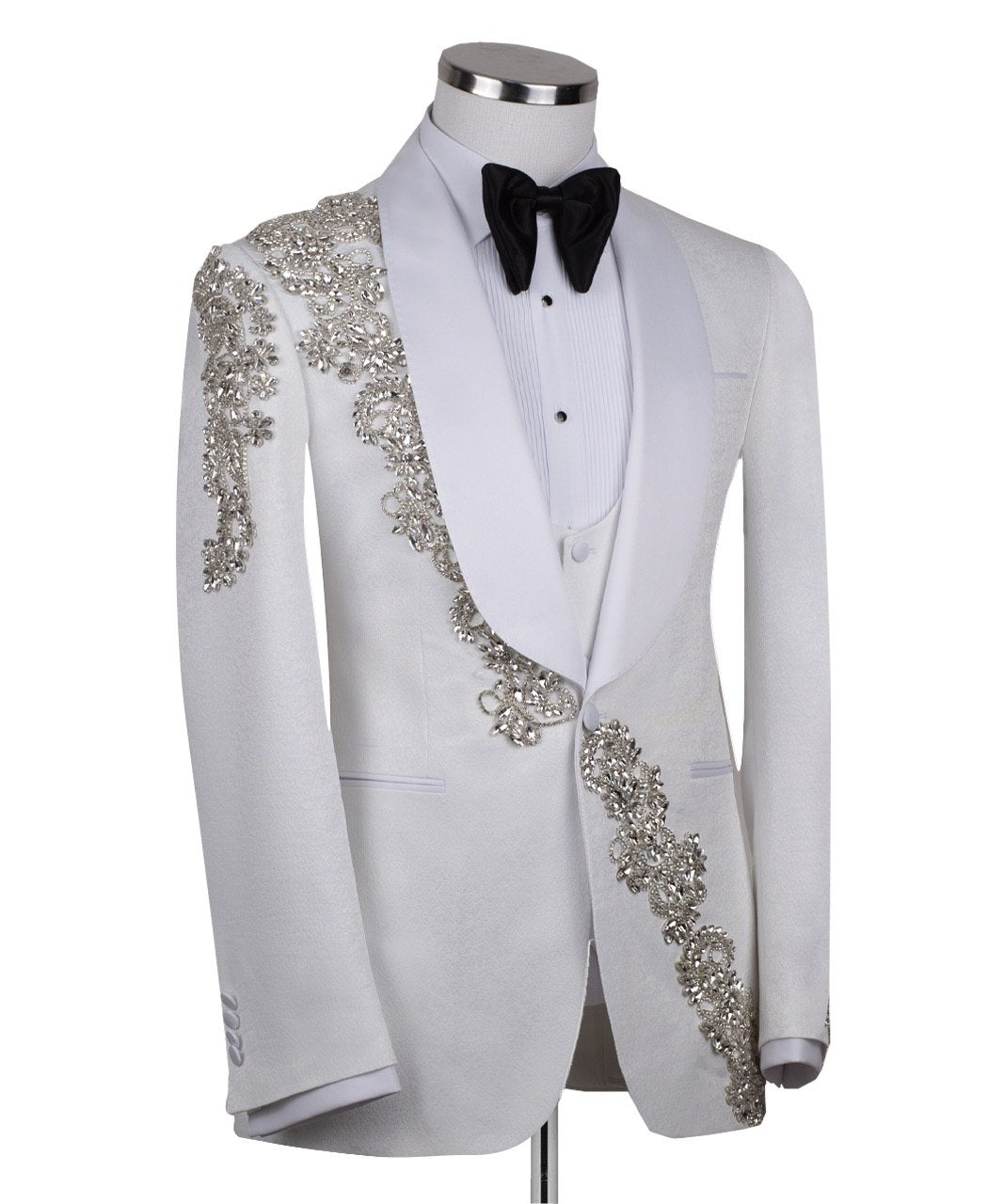 White hand-embellished jacquard three-piece tuxedo with crystal detailing on jacket and white satin shawl lapel. Master tailored in Istanbul for luxury events and weddings.