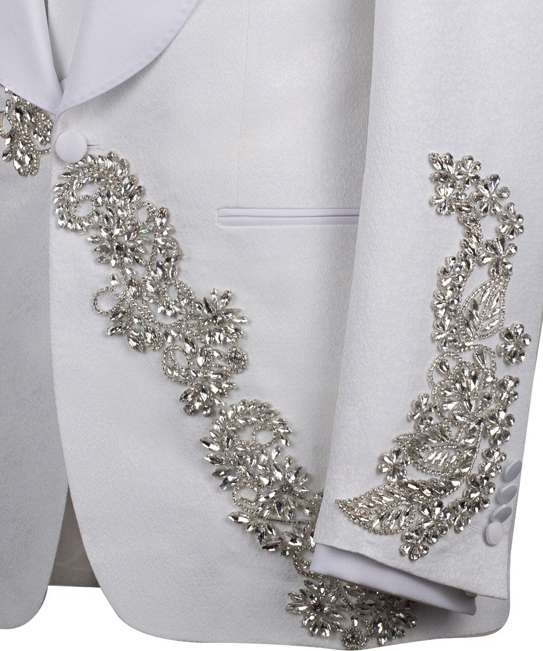 White hand-embellished jacquard three-piece tuxedo with crystal detailing on jacket and white satin shawl lapel. Master tailored in Istanbul for luxury events and weddings.