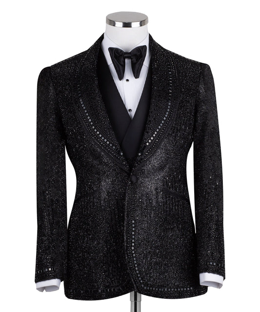 Front view of a black hand-embellished three-piece tuxedo by Charly Luxury, featuring a single-breasted jacket with satin shawl lapels and a double-breasted vest, showcased on a mannequin.