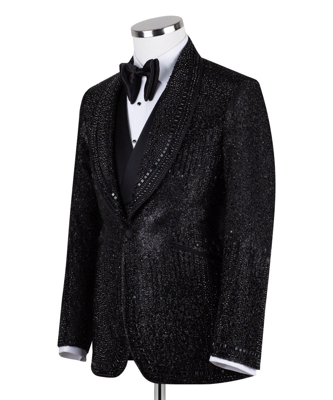 Front view of a black hand-embellished three-piece tuxedo by Charly Luxury, featuring a single-breasted jacket with satin shawl lapels and a double-breasted vest, showcased on a mannequin.