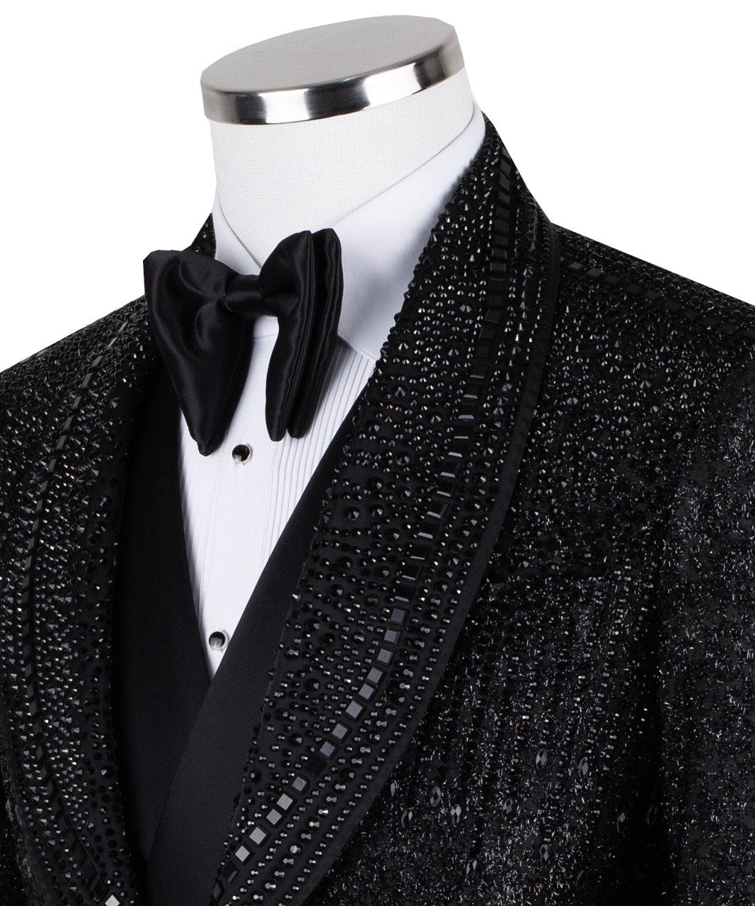 Front view of a black hand-embellished three-piece tuxedo by Charly Luxury, featuring a single-breasted jacket with satin shawl lapels and a double-breasted vest, showcased on a mannequin.