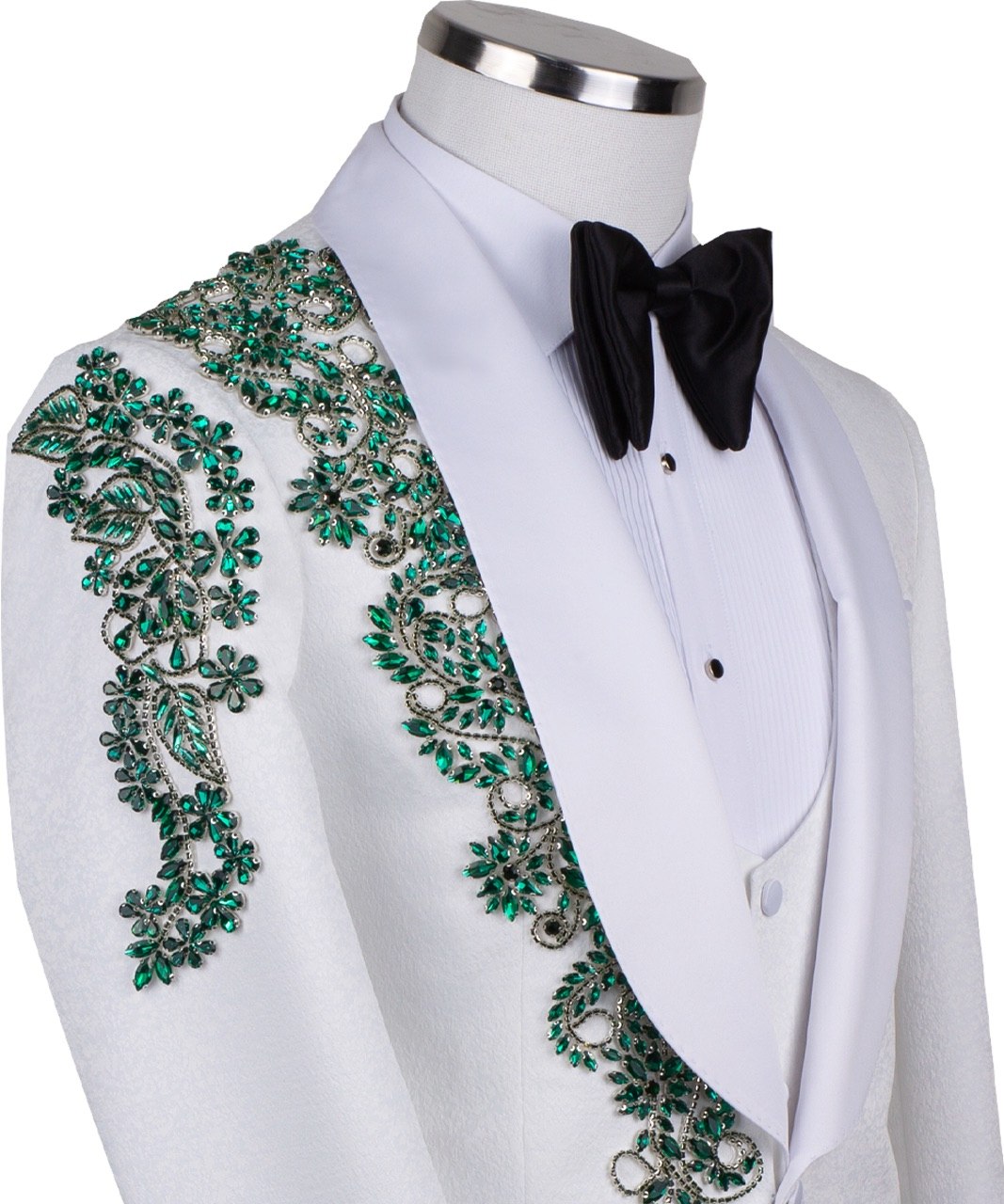 Charly Luxury white three-piece tuxedo with intricate emerald green hand-embellished details on the jacket, shoulders, and sleeves. Features a white shawl lapel and vest. Front view and side view of the luxury suit on a mannequin.