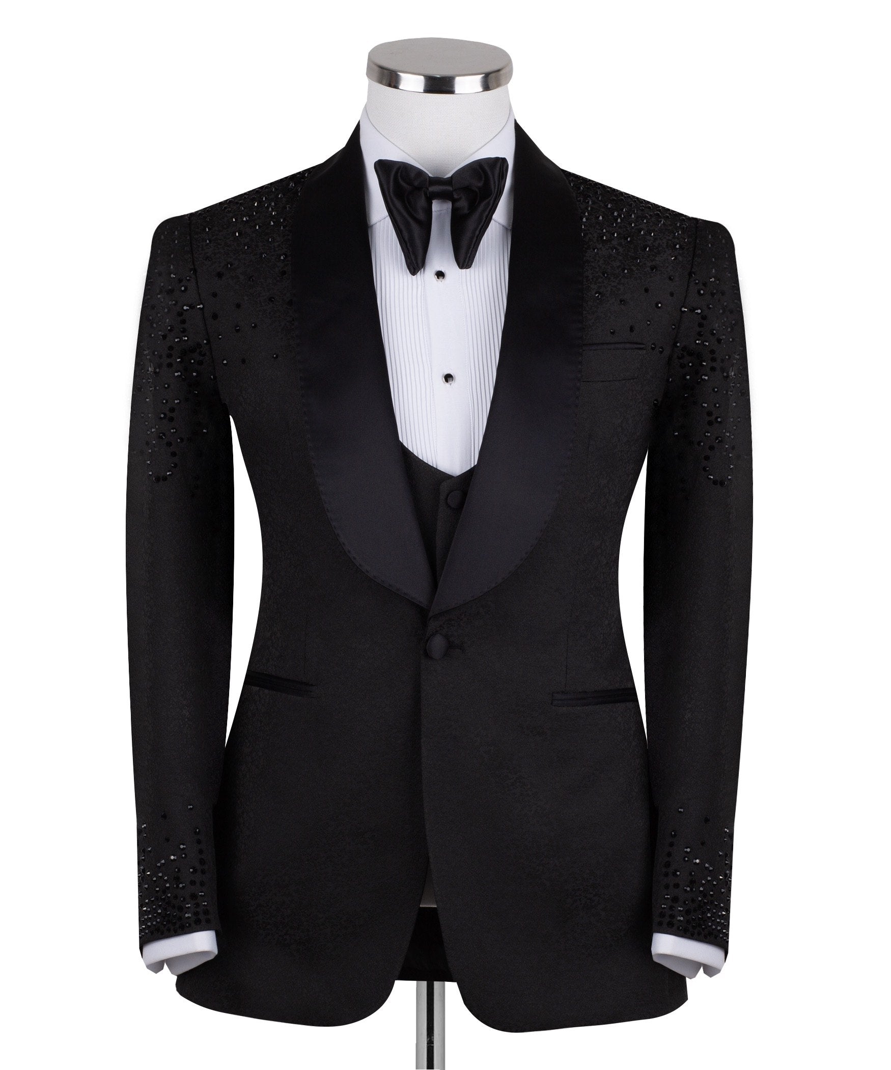 Black hand-embellished three-piece tuxedo by Charly Luxury, featuring an intricate beaded pattern on the shoulders and back, satin shawl lapel, and matching vest and trousers. Masterfully crafted in Istanbul for luxury events.