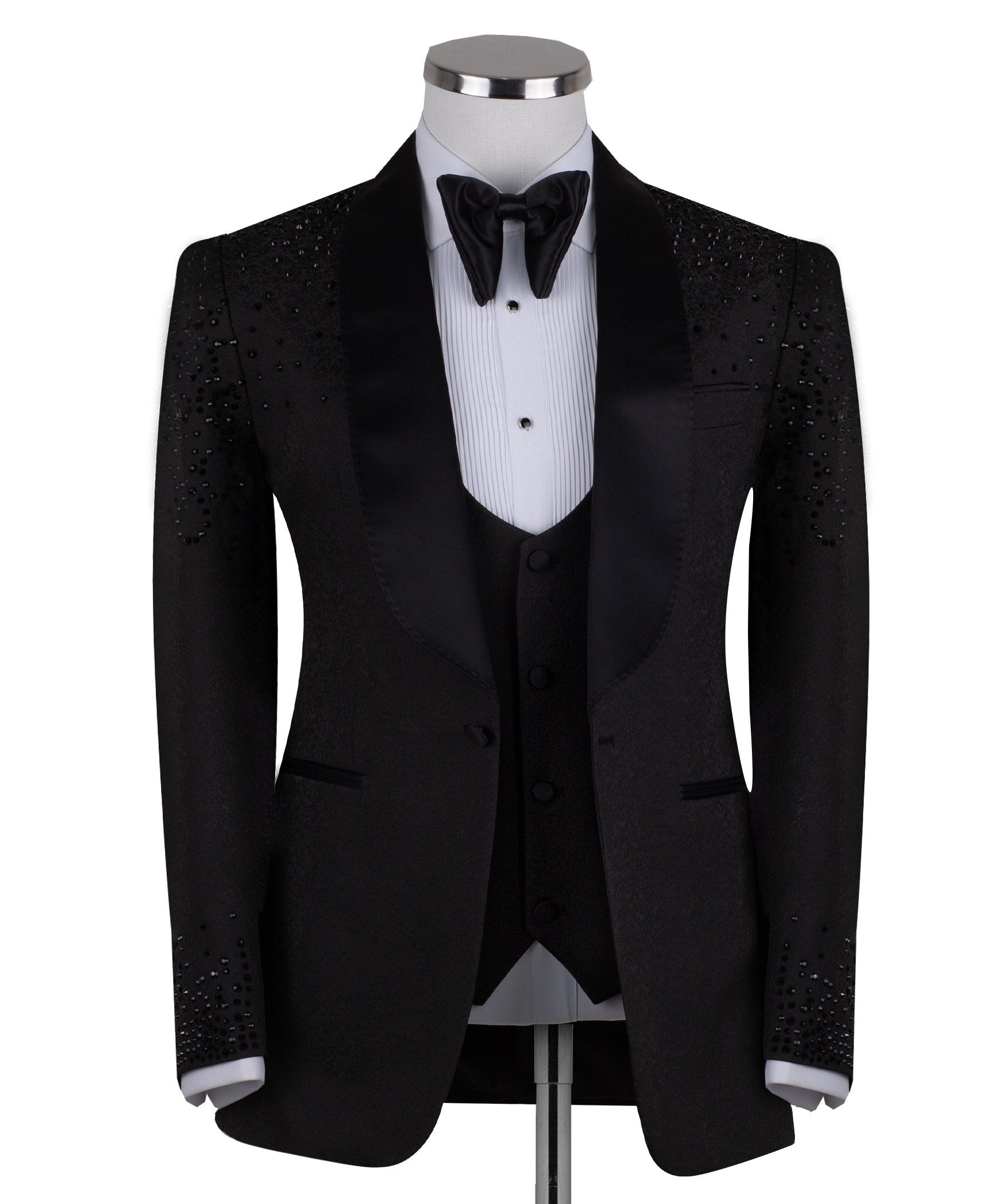 Black hand-embellished three-piece tuxedo by Charly Luxury, featuring an intricate beaded pattern on the shoulders and back, satin shawl lapel, and matching vest and trousers. Masterfully crafted in Istanbul for luxury events.