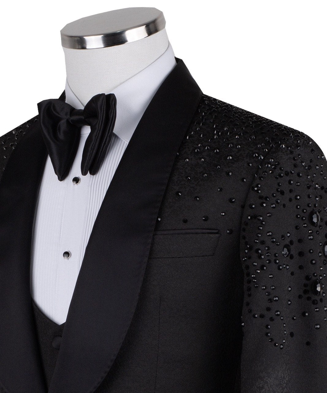 Black hand-embellished three-piece tuxedo by Charly Luxury, featuring an intricate beaded pattern on the shoulders and back, satin shawl lapel, and matching vest and trousers. Masterfully crafted in Istanbul for luxury events.