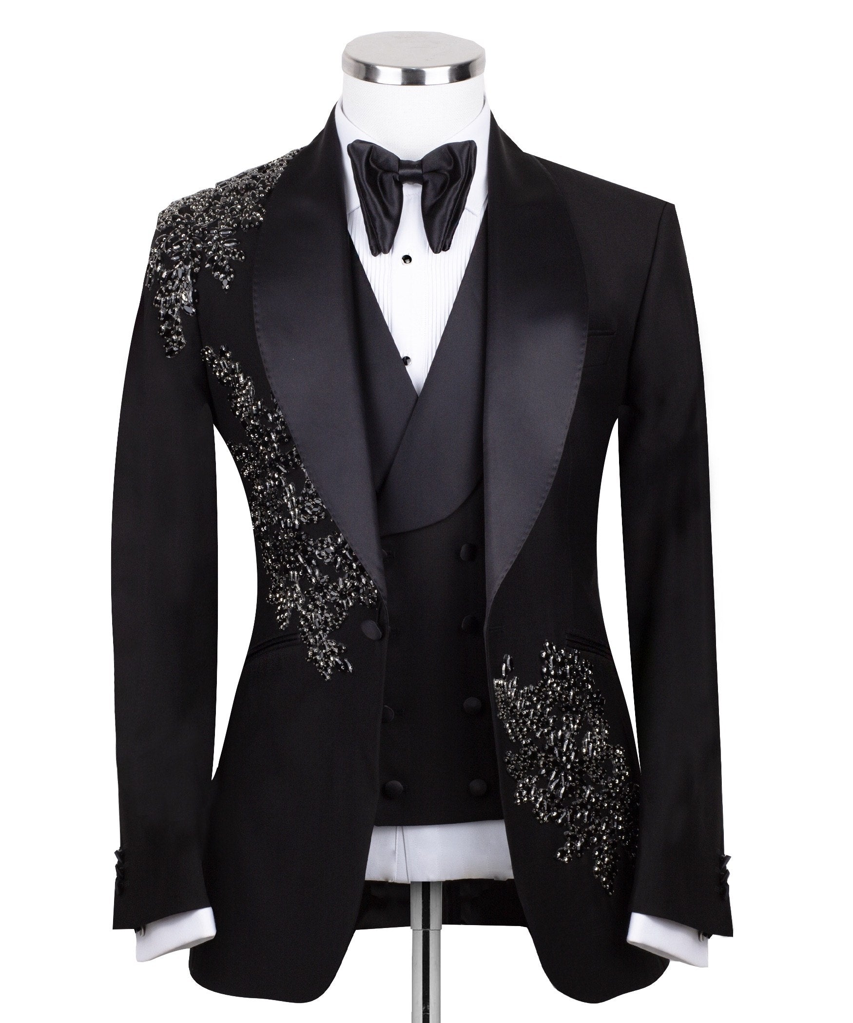 Charly Luxury Black Embellished Three-Piece Tuxedo. Handcrafted single-breasted jacket with peak lapel and shimmering crystal embellishments. Includes matching double-breasted vest and trousers.