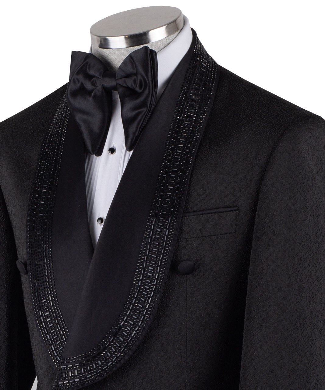 Front view of a black textured double-breasted tuxedo with hand-embellished shawl lapels, cuffs, and front trim. The trousers have a satin side stripe. High-end luxury formal wear from Charly Luxury.