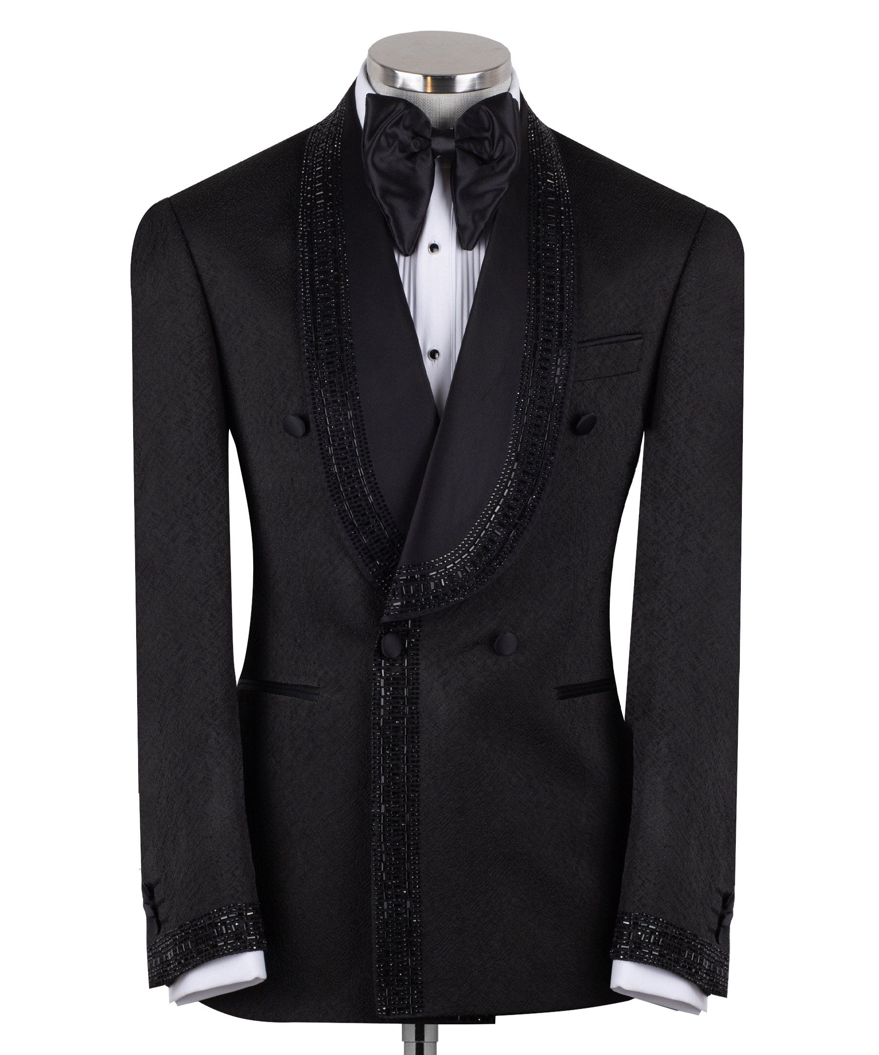 Front view of a black textured double-breasted tuxedo with hand-embellished shawl lapels, cuffs, and front trim. The trousers have a satin side stripe. High-end luxury formal wear from Charly Luxury.