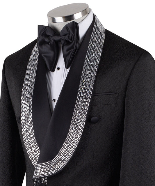 Black double-breasted tuxedo jacket with intricate silver hand-embellished shawl lapels, front detail, and cuffs, paired with black satin stripe trousers on a mannequin. From Charly Luxury, handcrafted in Istanbul.