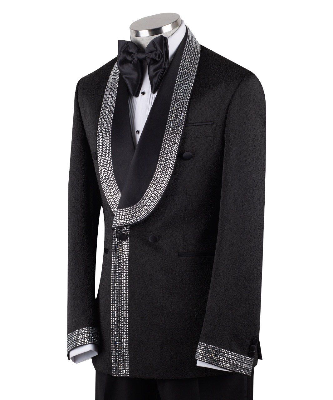Black double-breasted tuxedo jacket with intricate silver hand-embellished shawl lapels, front detail, and cuffs, paired with black satin stripe trousers on a mannequin. From Charly Luxury, handcrafted in Istanbul.