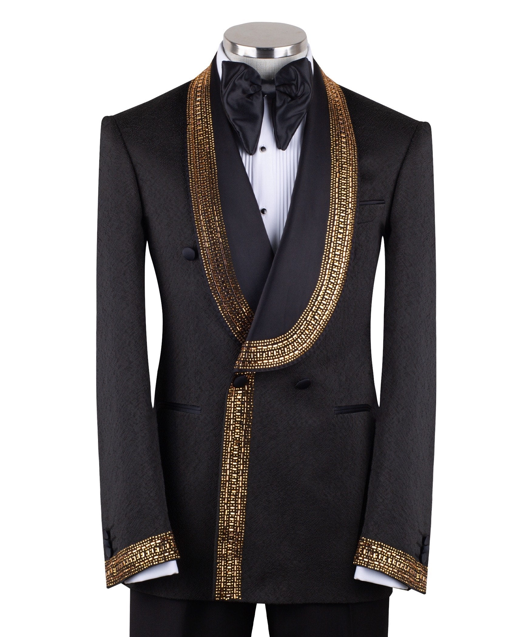 Mannequin wearing a black double-breasted tuxedo with ornate gold beaded peak lapels and matching cuff embellishments, paired with black satin-striped trousers.