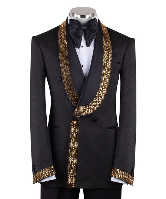 Mannequin wearing a black double-breasted tuxedo with ornate gold beaded peak lapels and matching cuff embellishments, paired with black satin-striped trousers.