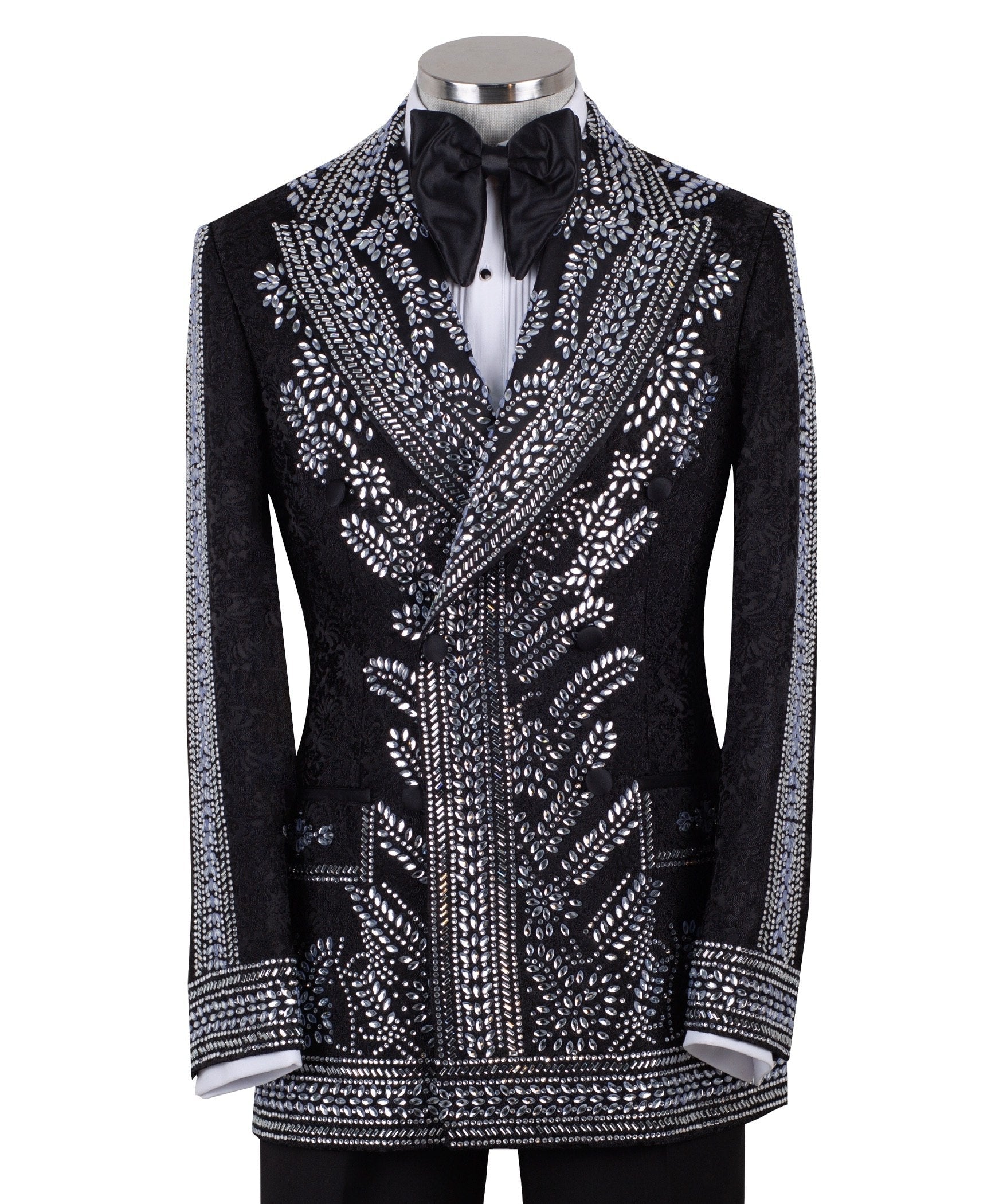 Front view of a black double-breasted tuxedo jacket with extensive silver embellishments, featuring a peak lapel and slim fit design on a mannequin. Back view and close-up showing intricate hand-beading detail.