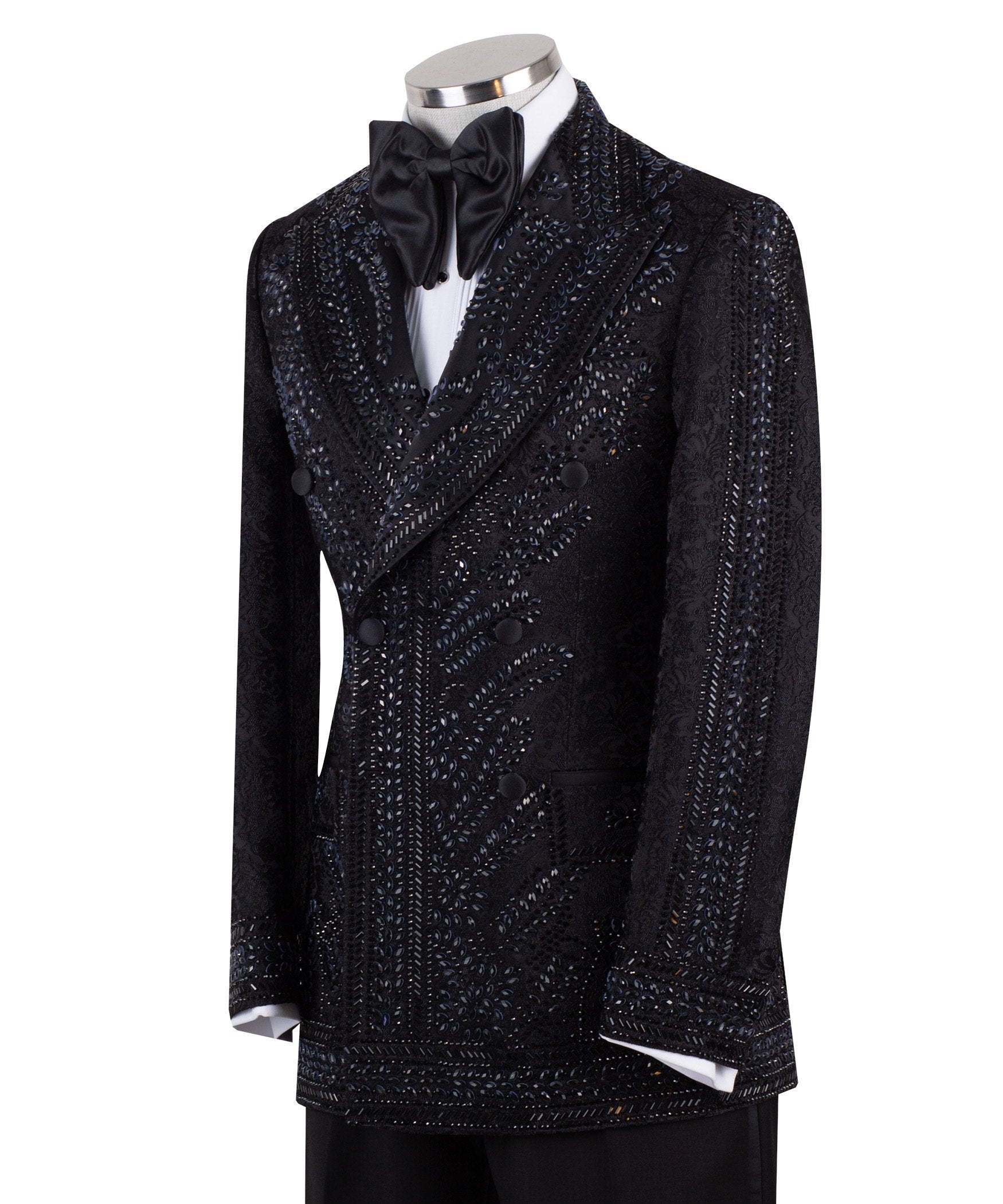 Front view of a luxurious black embellished jacquard double-breasted tuxedo jacket with intricate sequin and bead work on lapels, body, and sleeves, paired with black trousers, worn on a mannequin. From Charly Luxury, handcrafted in Istanbul.