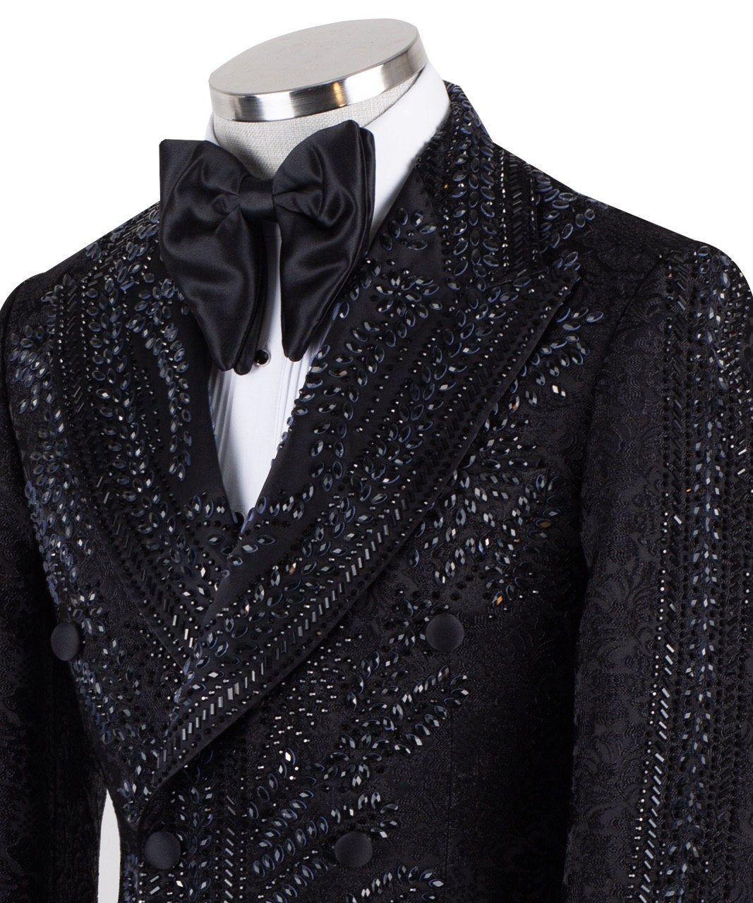Front view of a luxurious black embellished jacquard double-breasted tuxedo jacket with intricate sequin and bead work on lapels, body, and sleeves, paired with black trousers, worn on a mannequin. From Charly Luxury, handcrafted in Istanbul.