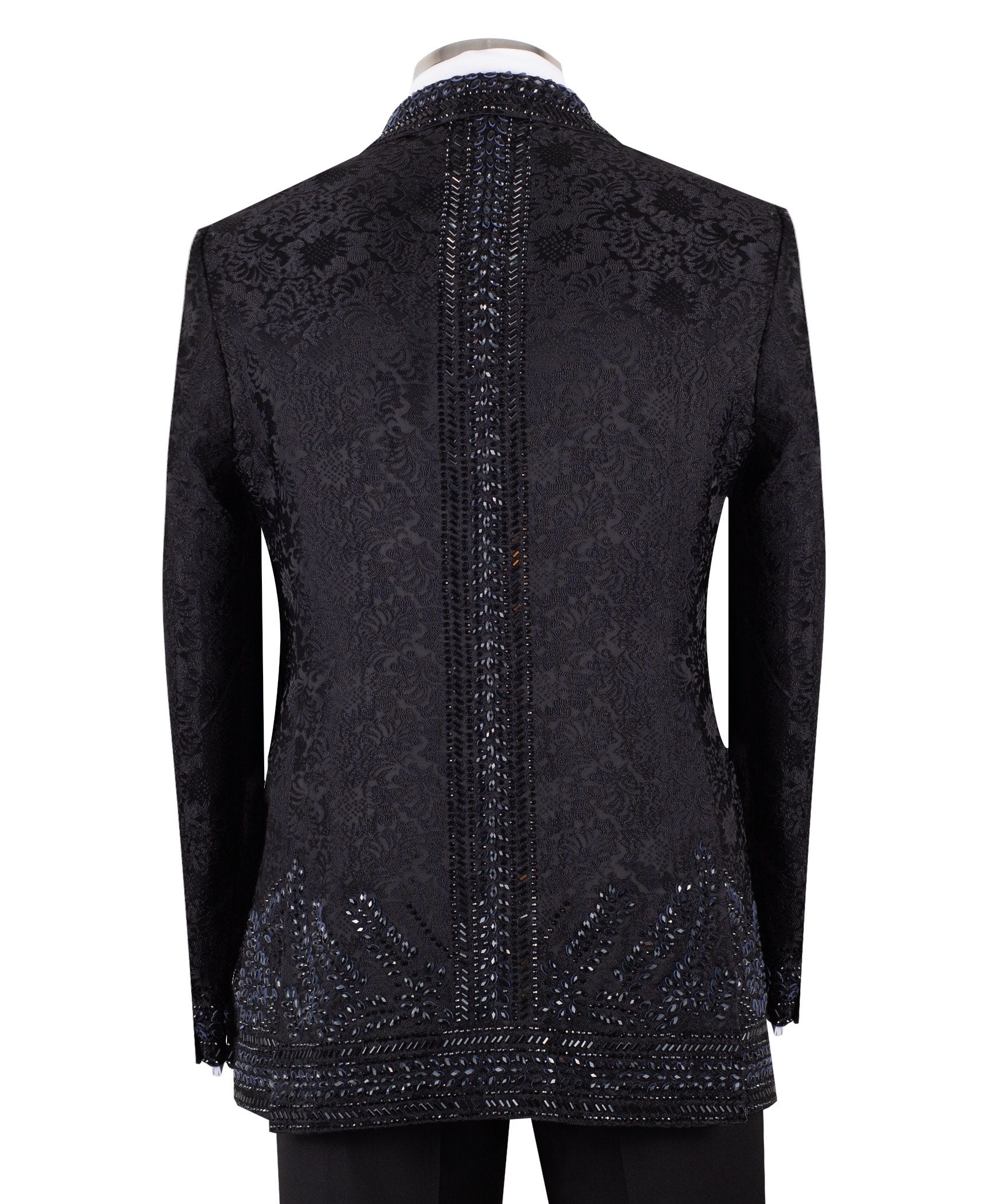 Front view of a luxurious black embellished jacquard double-breasted tuxedo jacket with intricate sequin and bead work on lapels, body, and sleeves, paired with black trousers, worn on a mannequin. From Charly Luxury, handcrafted in Istanbul.