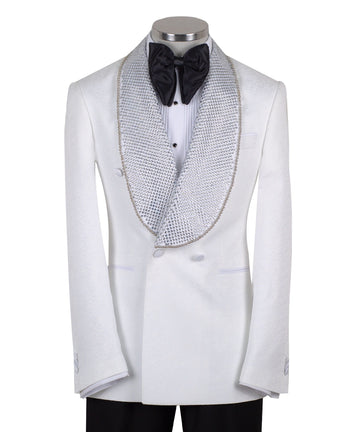 Full shot of a white double-breasted tuxedo with silver crystal-embellished shawl lapels and black trousers with satin stripes, displayed on a mannequin. Handcrafted luxury suit from Charly Luxury.