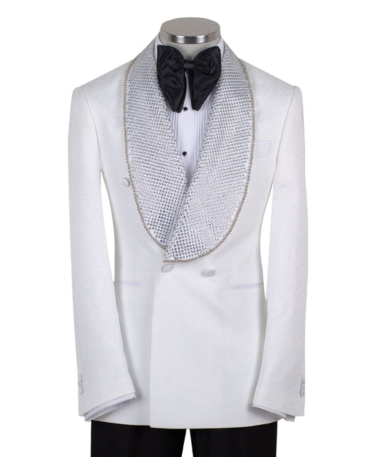 Full shot of a white double-breasted tuxedo with silver crystal-embellished shawl lapels and black trousers with satin stripes, displayed on a mannequin. Handcrafted luxury suit from Charly Luxury.