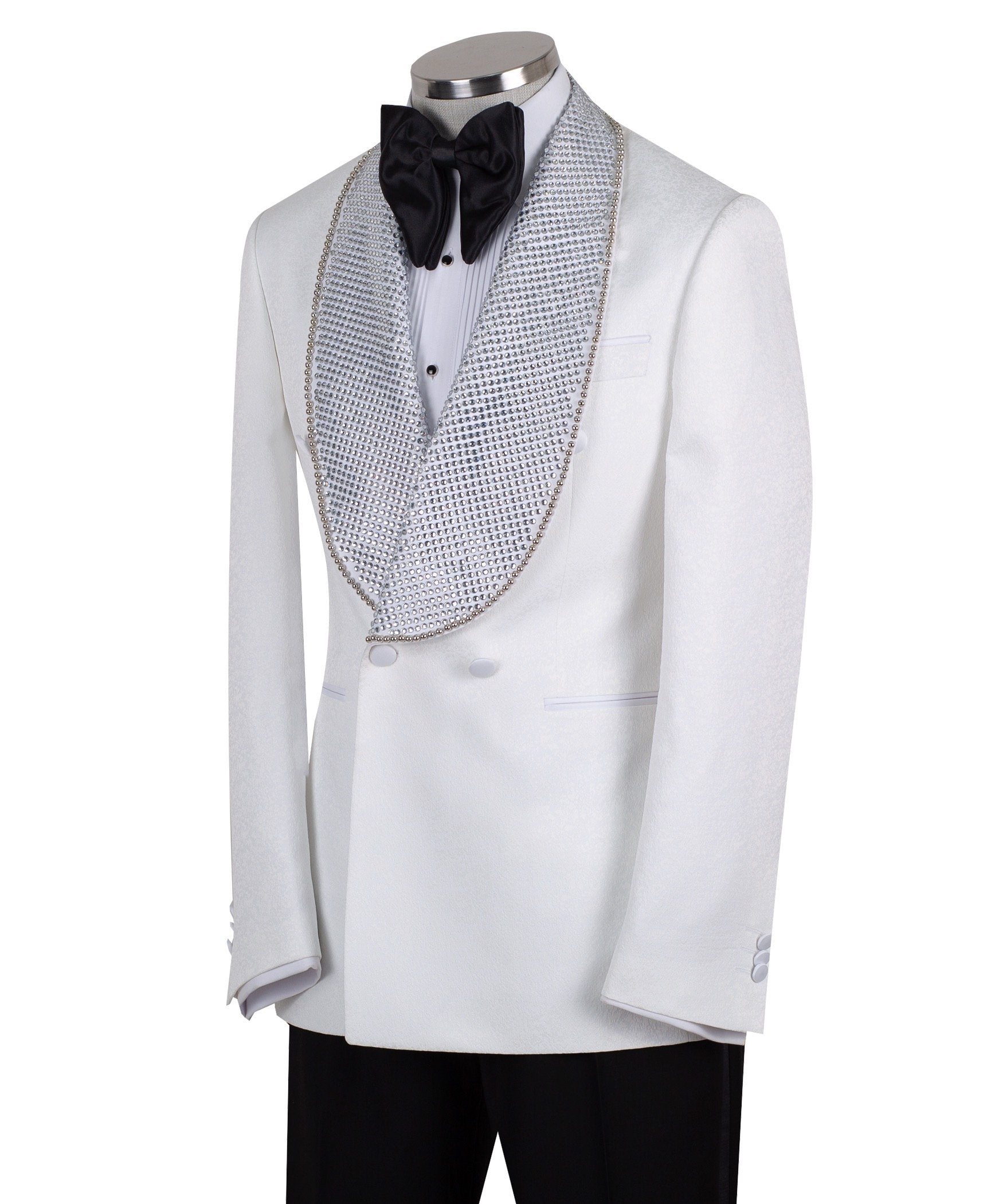 Full shot of a white double-breasted tuxedo with silver crystal-embellished shawl lapels and black trousers with satin stripes, displayed on a mannequin. Handcrafted luxury suit from Charly Luxury.