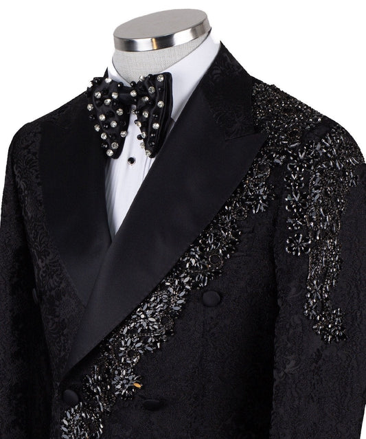 Black embellished jacquard double-breasted tuxedo with satin peak lapels and hand-beaded details on the shoulders and lapel, shown with matching plain black trousers with satin side stripe, handcrafted by Charly Luxury in Istanbul.