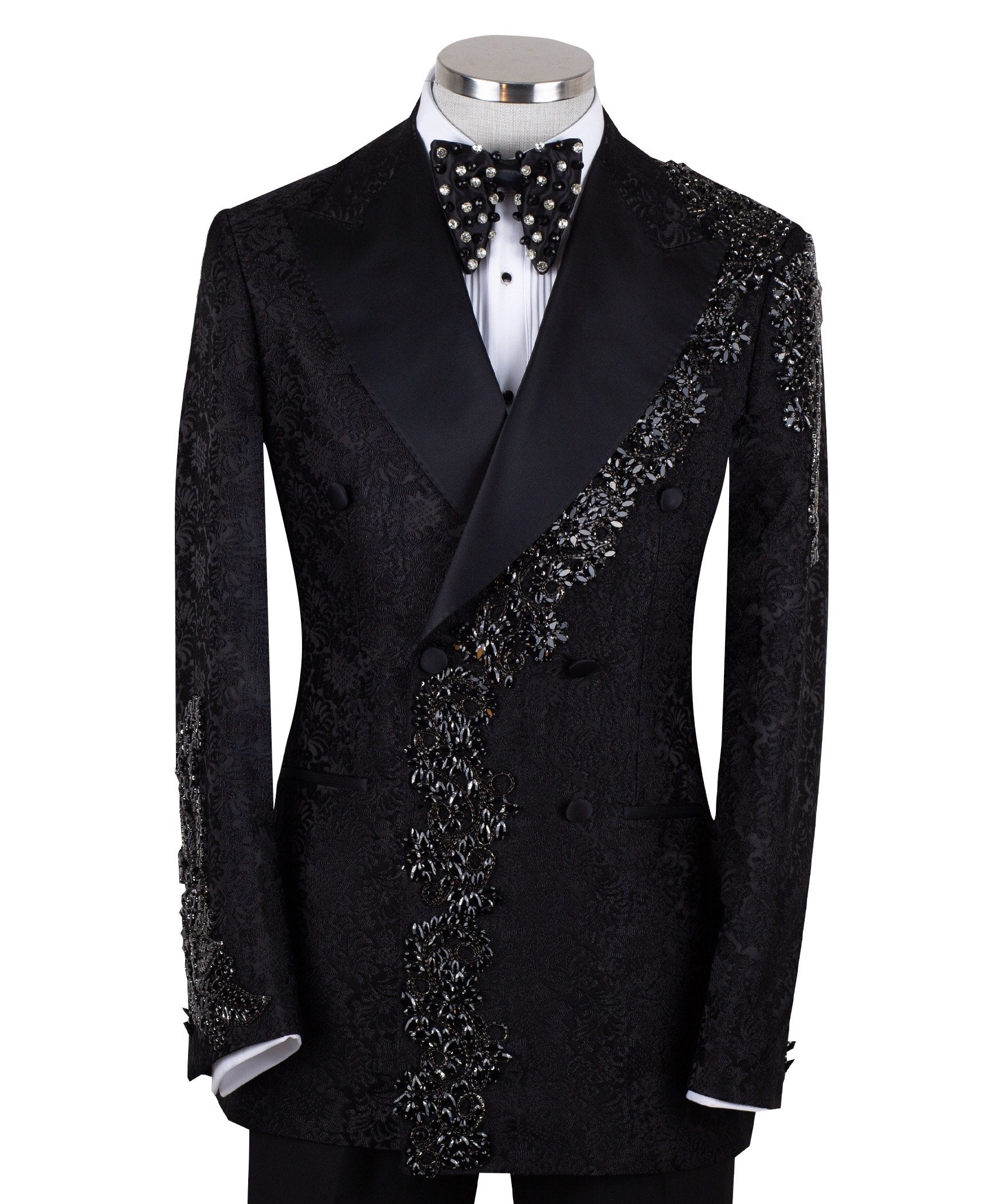 Black embellished jacquard double-breasted tuxedo with satin peak lapels and hand-beaded details on the shoulders and lapel, shown with matching plain black trousers with satin side stripe, handcrafted by Charly Luxury in Istanbul.