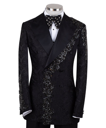 Black embellished jacquard double-breasted tuxedo with satin peak lapels and hand-beaded details on the shoulders and lapel, shown with matching plain black trousers with satin side stripe, handcrafted by Charly Luxury in Istanbul.