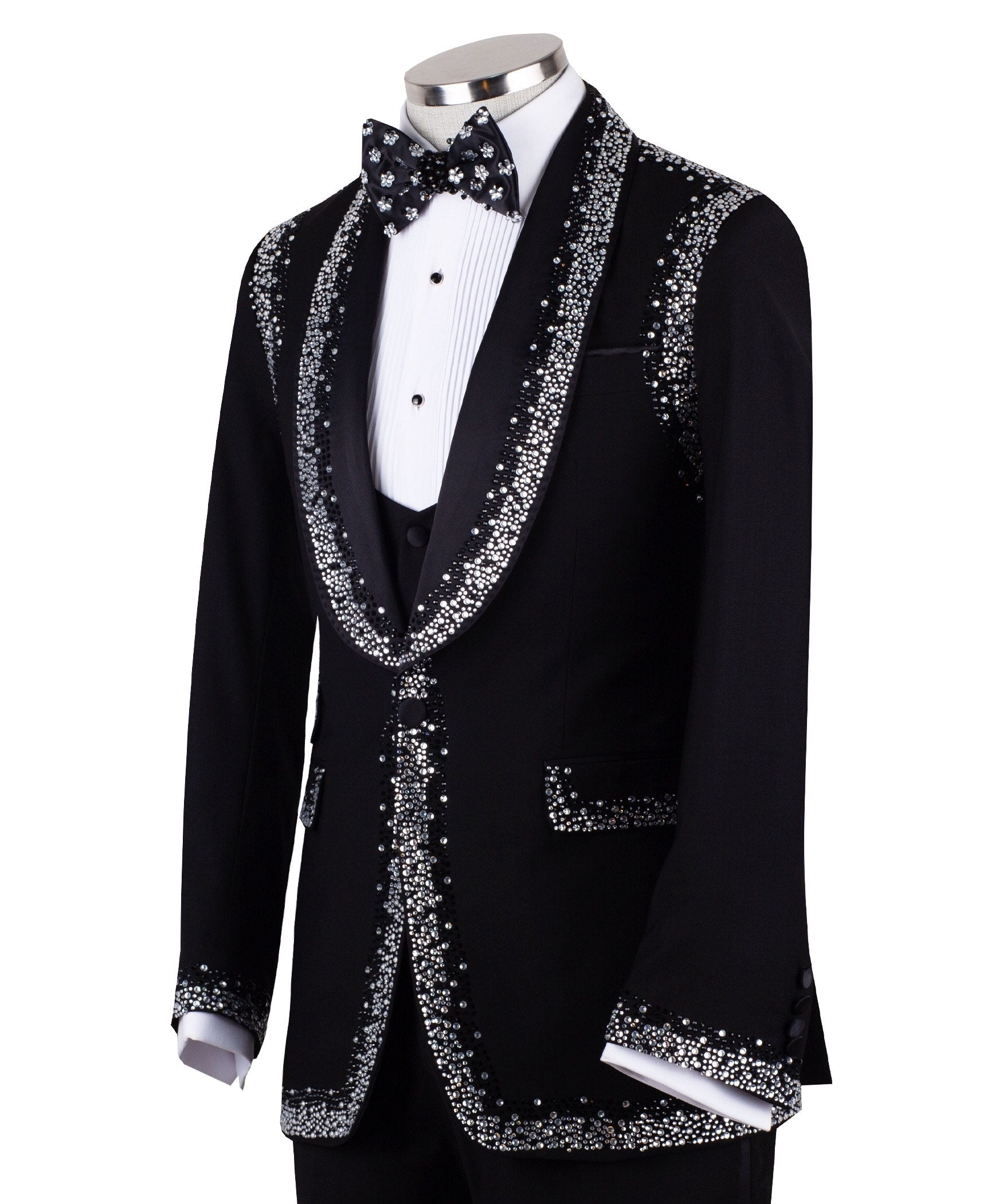Charly Luxury Black Embellished Shawl Lapel Tuxedo, featuring shimmering silver crystals hand-embellished on lapels, shoulders, pockets, and cuffs. The tuxedo includes a black single-breasted jacket, matching vest, and trousers, displayed on a mannequin. This luxury evening wear is handcrafted in Istanbul, showcasing master tailoring and intricate crystal detailing for a glamorous, statement look.