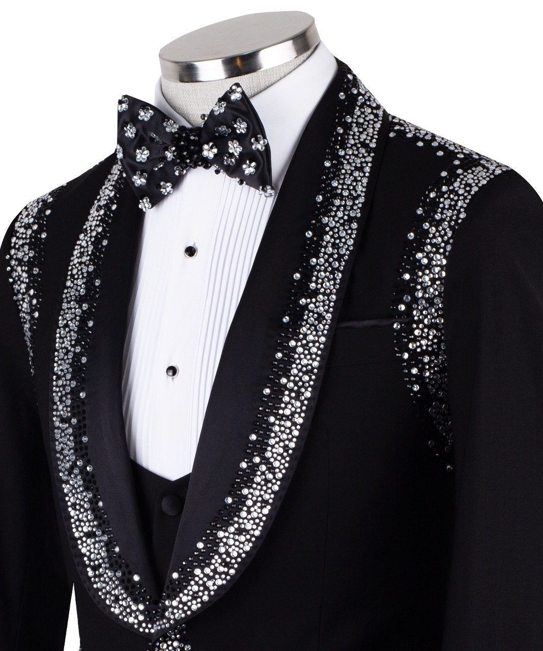 Charly Luxury Black Embellished Shawl Lapel Tuxedo, featuring shimmering silver crystals hand-embellished on lapels, shoulders, pockets, and cuffs. The tuxedo includes a black single-breasted jacket, matching vest, and trousers, displayed on a mannequin. This luxury evening wear is handcrafted in Istanbul, showcasing master tailoring and intricate crystal detailing for a glamorous, statement look.