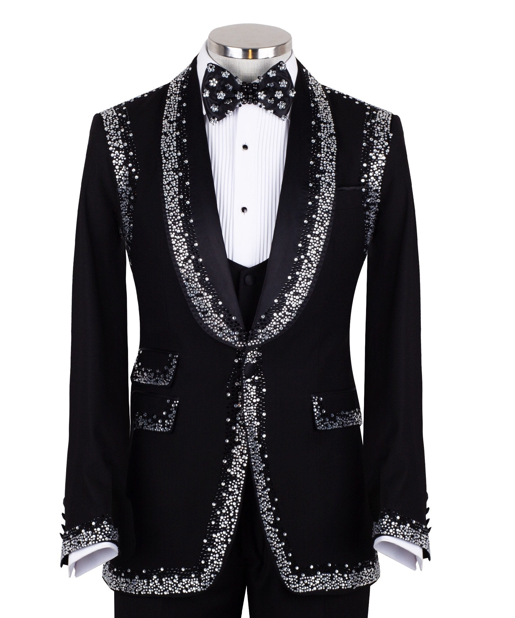 Charly Luxury Black Embellished Shawl Lapel Tuxedo, featuring shimmering silver crystals hand-embellished on lapels, shoulders, pockets, and cuffs. The tuxedo includes a black single-breasted jacket, matching vest, and trousers, displayed on a mannequin. This luxury evening wear is handcrafted in Istanbul, showcasing master tailoring and intricate crystal detailing for a glamorous, statement look.
