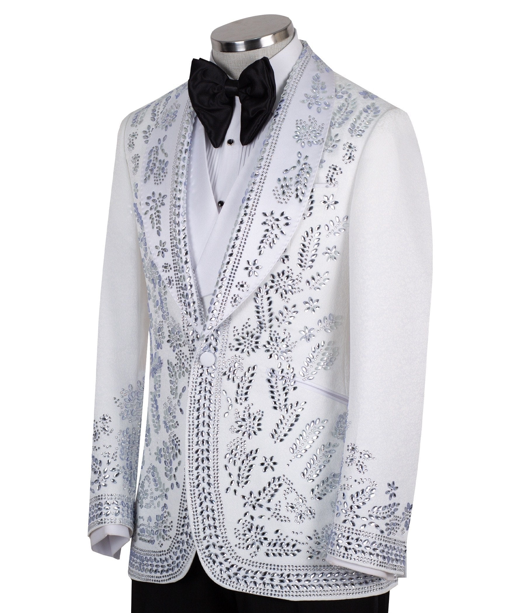 Front view of a white heavily embellished three-piece tuxedo with silver sequins and beadwork, featuring a shawl lapel and a matching white vest, displayed on a mannequin. Handmade in Istanbul.