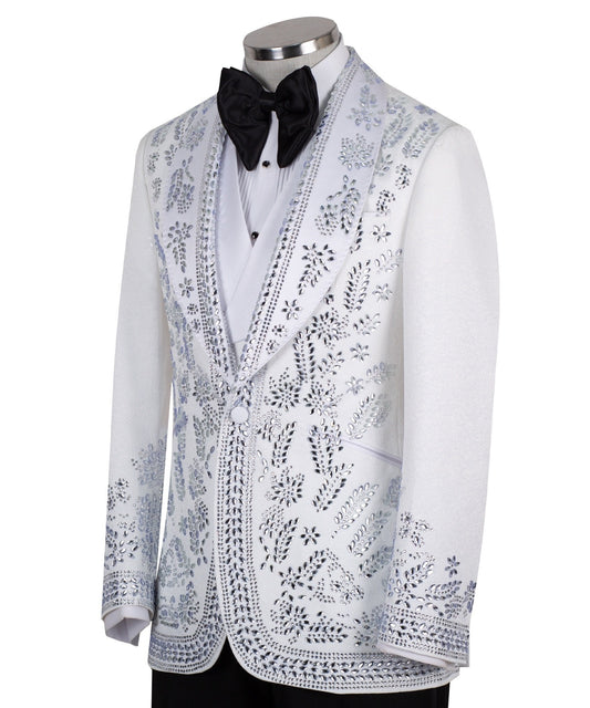 Front view of a white heavily embellished three-piece tuxedo with silver sequins and beadwork, featuring a shawl lapel and a matching white vest, displayed on a mannequin. Handmade in Istanbul.