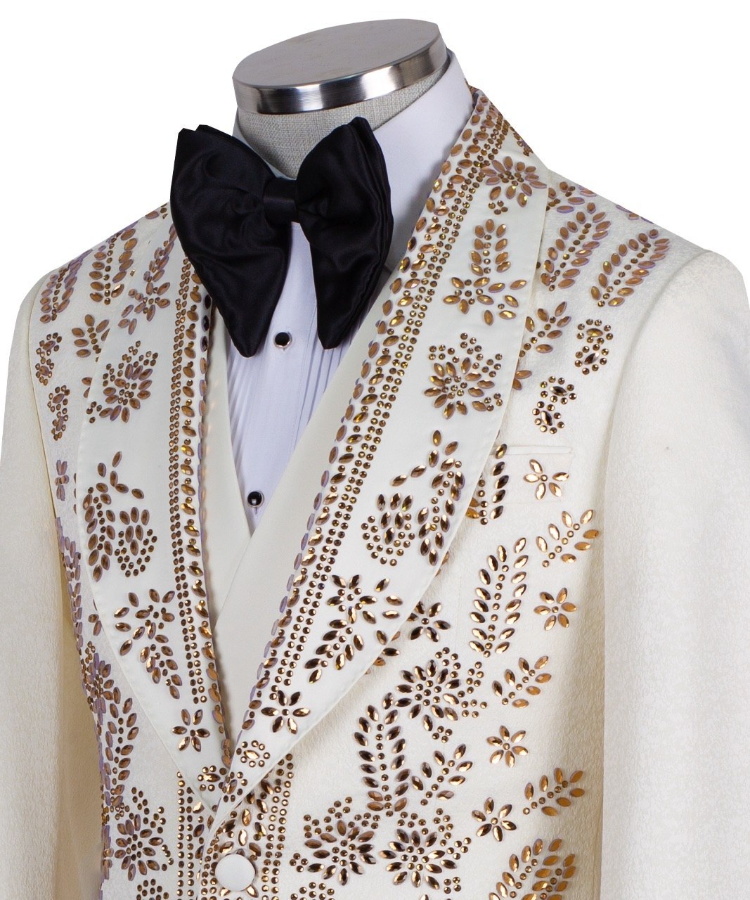 Cream and gold hand-embellished tuxedo jacket, vest, and black trousers from Charly Luxury, handcrafted in Istanbul. Features intricate floral metallic stud detailing on a slim-fit, peak lapel design.