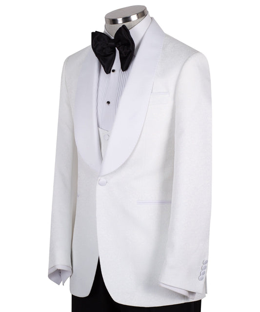 Front view of a white jacquard patterned single-breasted tuxedo jacket with a white satin shawl lapel, displayed on a mannequin. Includes a matching white jacquard vest and black trousers. Handmade in Istanbul luxury bespoke menswear.