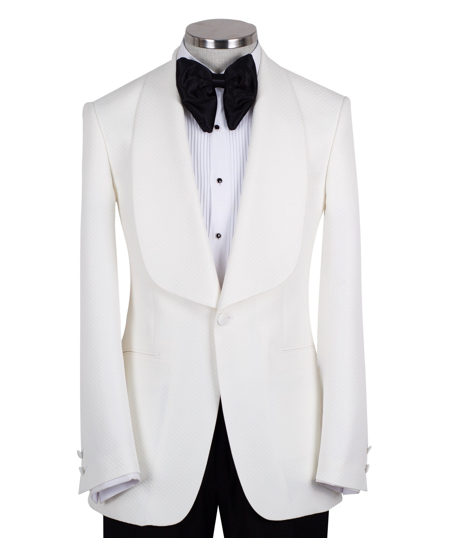 White textured shawl lapel tuxedo jacket and black trousers by Charly Luxury, handcrafted in Istanbul. View shows single-button closure and elegant detailing.