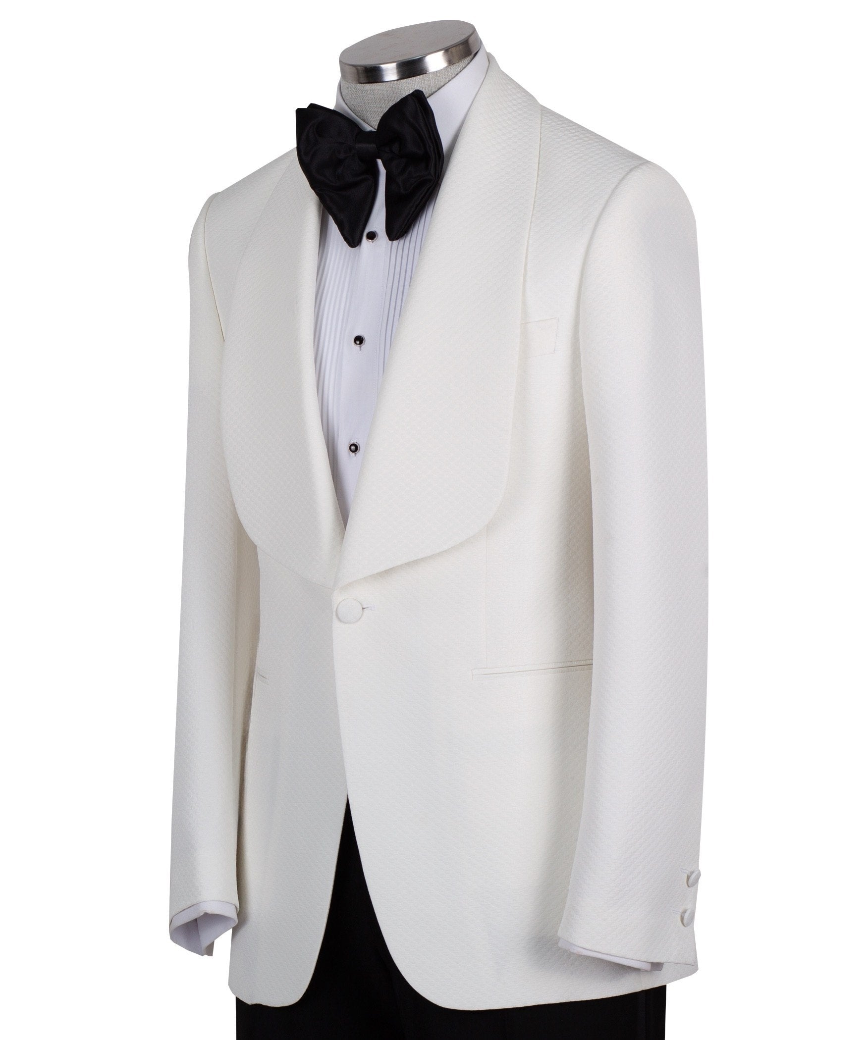 White textured shawl lapel tuxedo jacket and black trousers by Charly Luxury, handcrafted in Istanbul. View shows single-button closure and elegant detailing.