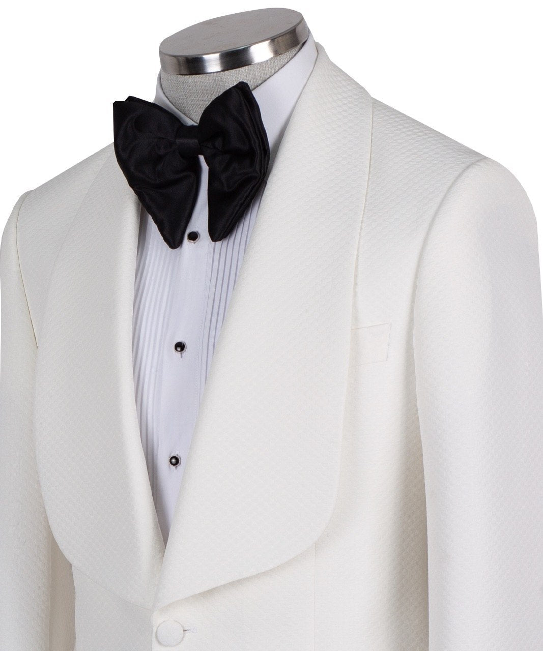 White textured shawl lapel tuxedo jacket and black trousers by Charly Luxury, handcrafted in Istanbul. View shows single-button closure and elegant detailing.