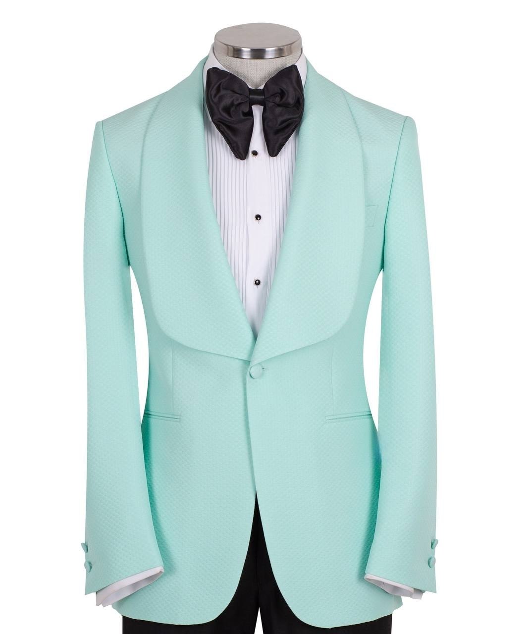 Aqua textured fabric shawl lapel tuxedo jacket on a mannequin, single-breasted, one-button closure. Showcase of Charly Luxury's luxury handcrafted Istanbul tailoring.