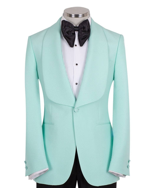 Aqua textured fabric shawl lapel tuxedo jacket on a mannequin, single-breasted, one-button closure. Showcase of Charly Luxury's luxury handcrafted Istanbul tailoring.