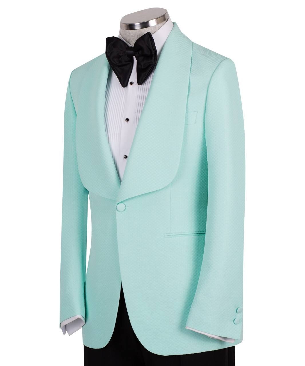 Aqua textured fabric shawl lapel tuxedo jacket on a mannequin, single-breasted, one-button closure. Showcase of Charly Luxury's luxury handcrafted Istanbul tailoring.