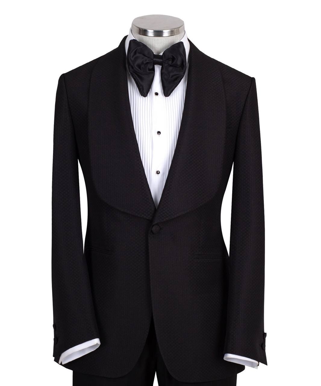 Black single-breasted tuxedo with subtle jacquard pattern and elegant shawl lapel, handcrafted in Istanbul by Charly Luxury, front view on mannequin.
